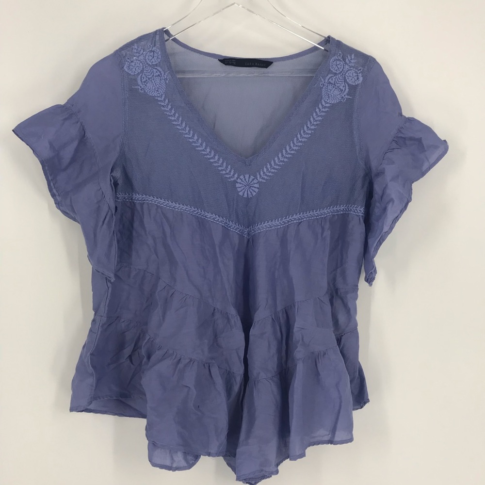 Zara blue flutter sleeve blouse with mesh top.